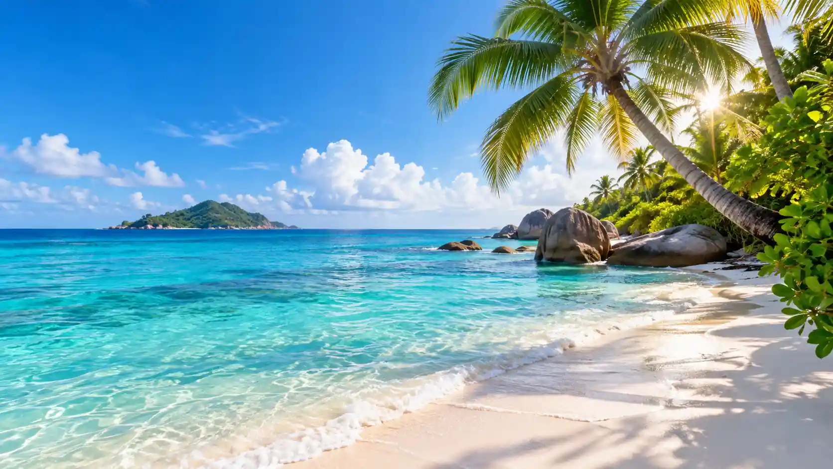 Tropical beach with turquoise sea, blue sky and palm trees